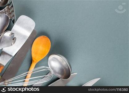 Used home kitchenware with scratches on gray paper background