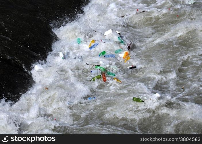 Used plastic bottles float in the waters of the Tiber river in Rome