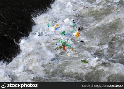 Used plastic bottles float in the waters of the Tiber river in Rome
