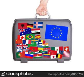 Used plastic suitcase with lots of small stickers, large sticker of the European Union