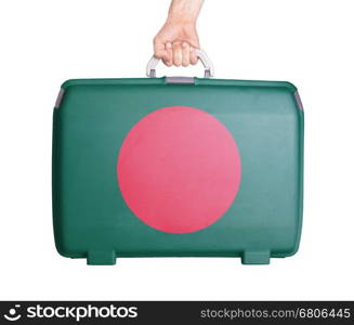 Used plastic suitcase with stains and scratches, printed with flag, Bangladesh
