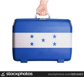 Used plastic suitcase with stains and scratches, printed with flag, Honduras