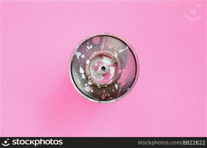 Used spray can with pink paint drips lie on texture background of fashion pastel pink color paper in minimal concept.. Used spray can with pink paint drips lie on texture background of fashion pastel pink color paper in minimal concept