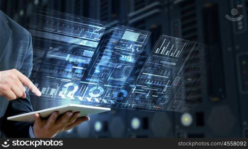 Using innovative technologies. Businessman using tablet over virtual interface background