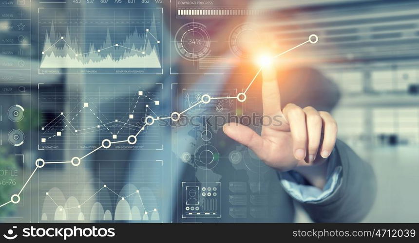 Using innovative technologies. Hand of businesswoman pressing icon on virtual screen