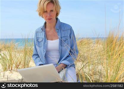 Using laptop at the beach