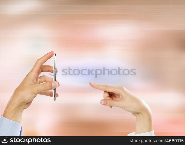 Using mobile phone. Close up of people hands using mobile phone