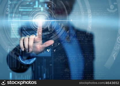 Using modern technologies. Businesswoman touchng with finger icon on virtual screen