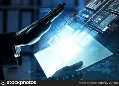 Using modern technologies. Close up of human hands using virtual panel