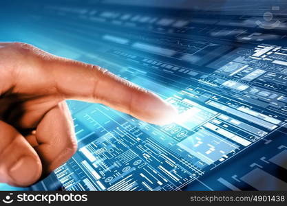 Using modern technologies. Close up of human hands using virtual panel