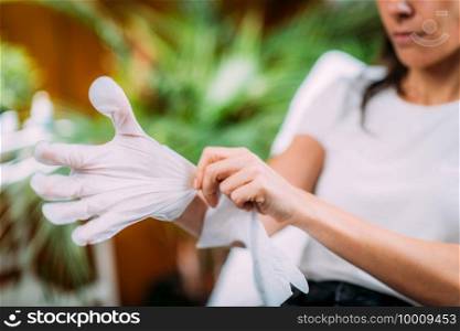 Using Moisturising Cosmetic Gloves to Moisturize Skin of the Hands at Home.  