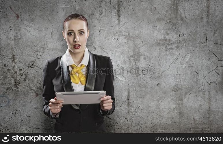 Using tablet pc. Young businesswoman holding tablet pc in hands