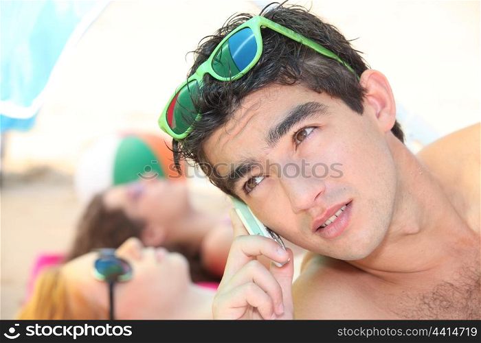 Using telephone at the beach