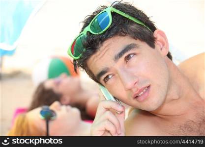 Using telephone at the beach