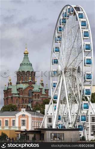 Uspenski Cathedral and the Skywheel in the city of Helsinki in Finland.