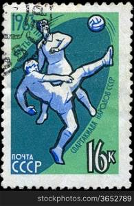 USSR - CIRCA 1963: stamp printed in the USSR (Russia) shows football with the inscription and name of a series &acute;1963, Third Games of people of the USSR&acute;, circa 1963