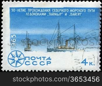 USSR - CIRCA 1965: stamp printed in USSR shows a Icebreakers with inscription  Passing of Northern Sea Route icebreakers Taimyr and Vaigach&acute; from series &acute;Investigation Arctic & Antarctic&acute;, circa 1965