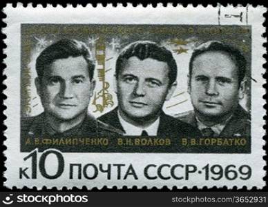 USSR - CIRCA 1969: A Stamp printed in the USSR shows the crew of the Soviet spaceship &acute;Union&acute; A.E.Filipchenko, V.N.Volkov, V.V. Gorbatko, circa 1969