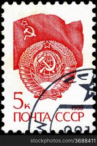 USSR - CIRCA 1988: A stamp printed in USSR shows State Emblem and flag of the Soviet Union , series &acute;Emblem&acute; , circa 1988