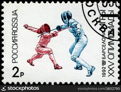 USSR - CIRCA 1992: A stamp printed in the USSR showing fencers, circa 1992