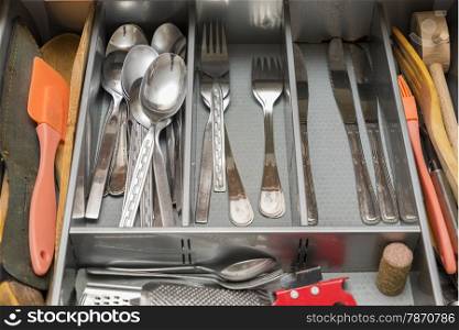 utensils in the kitchen drawer