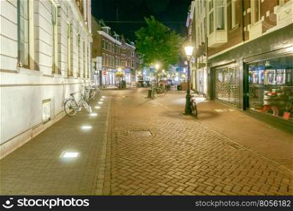 Utrecht. City street in night light.. Traditional urban street with lights at night in Utrecht. Netherlands.