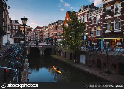Utrecht, The Netherlands, canal, beautiful houses, wharfs, trees and Old Canal with a boat