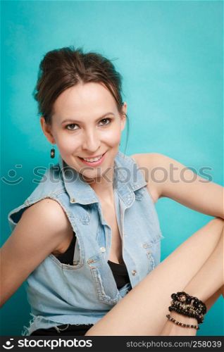 Vacation and summer fashion. fashionable girl in jeans shirt on blue