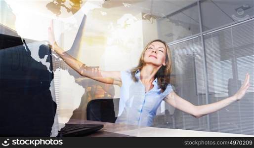 Vacation daydreams. Smiling woman with closed eyes is virtually flying in a modern office. Elements of this image furnished by NASA. Indulging in vacation daydreams