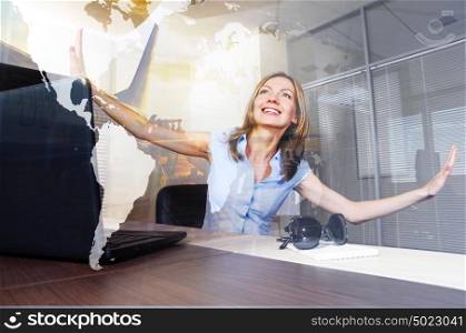 Vacation daydreams. Smiling woman with closed eyes is virtually flying in a modern office. Elements of this image furnished by NASA. Indulging in vacation daydreams
