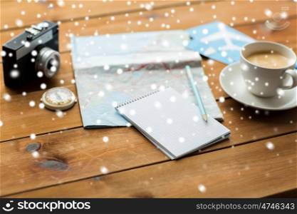 vacation, tourism, travel and objects concept - blank notepad with map, coffee and airplane tickets