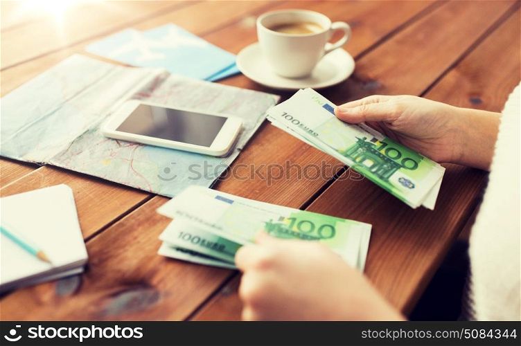 vacation, tourism, travel, finances and people concept - close up of traveler hands counting euro cash money. close up of traveler hands counting euro money. close up of traveler hands counting euro money