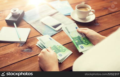 vacation, tourism, travel, finances and people concept - close up of traveler hands counting euro cash money. close up of traveler hands counting euro money