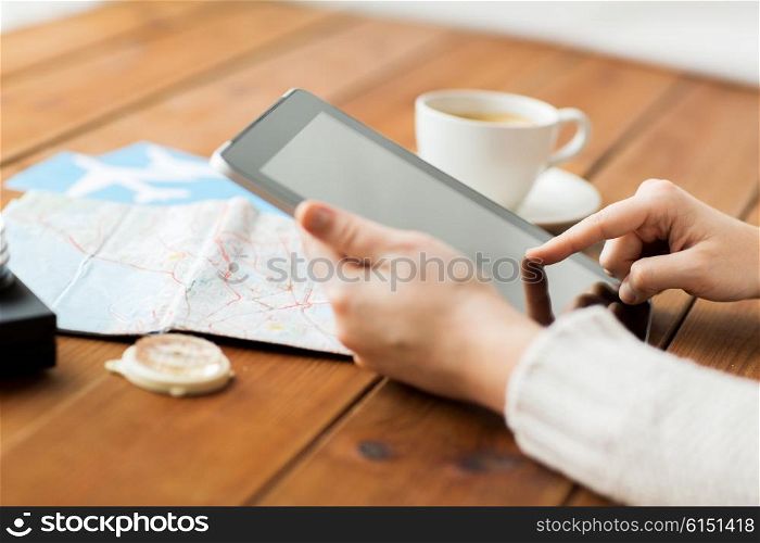 vacation, tourism, travel, technology and people concept - close up of traveler hands with blank tablet pc computer and map
