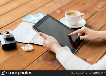 vacation, tourism, travel, technology and people concept - close up of traveler hands with blank tablet pc computer and map