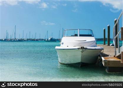 vacation, travel and sea concept - white boat at blue sea