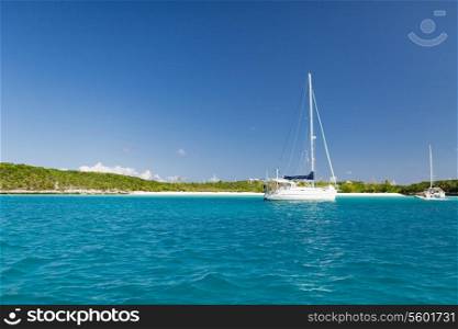 vacation, travel and sea concept - white boat at blue sea