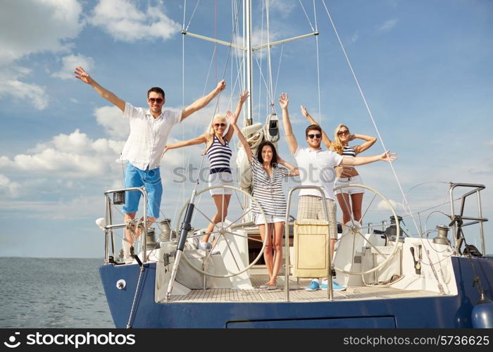 vacation, travel, sea, friendship and people concept - smiling friends sitting on yacht deck and greeting