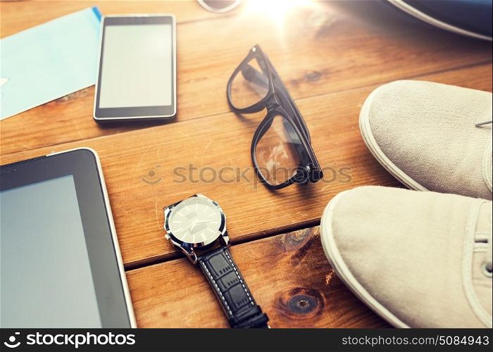 vacation, travel, tourism, technology and objects concept - close up of gadgets and traveler personal stuff. close up of gadgets and traveler personal stuff. close up of gadgets and traveler personal stuff
