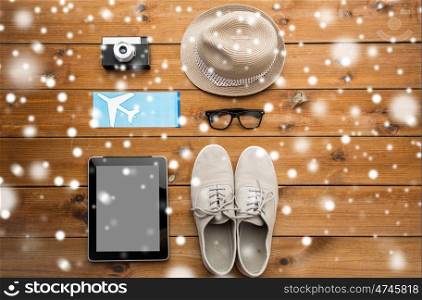 vacation, travel, tourism, winter holidays and objects concept -gadgets and traveler personal stuff