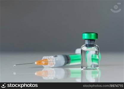 vaccine bottle and syringe injection medicine