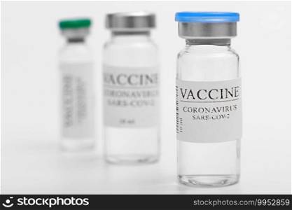vaccine selection. Ampoules with Covid-19 vaccine in laboratory. to fight the coronavirus sars-cov-2 pandemic. Glass vial medical close-up isolated on a white background. vaccine selection. Ampoules with Covid-19 vaccine in laboratory. to fight the coronavirus sars-cov-2 pandemic. Glass vial medical close-up isolated on a white background.