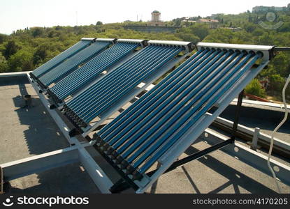 Vacuum solar water heating system on the house roof.