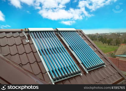 Vacuum solar water heating system on the house roof.