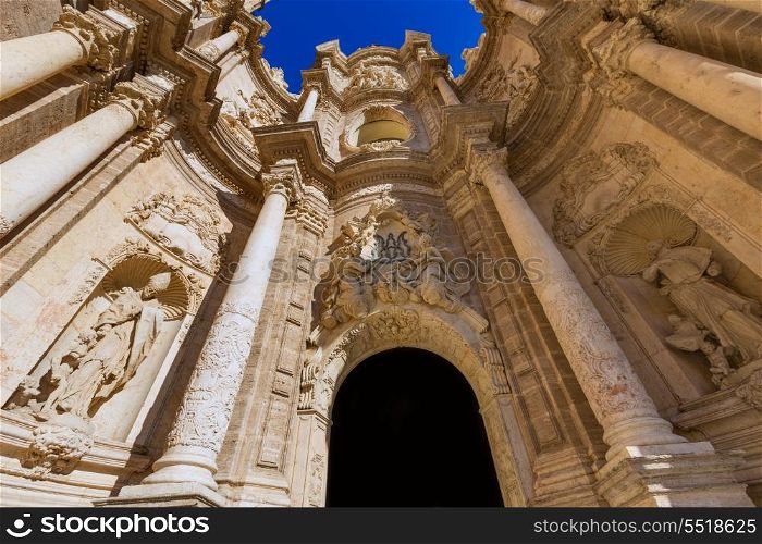 Valencia cathedral door in plaza de la Reina square of Spain