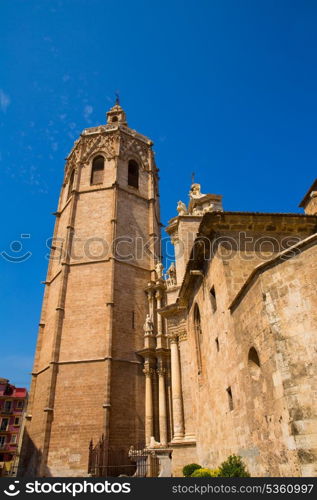 Valencia Cathedral facade and Miguelete Micalet in Plaza de la Reina at Spain