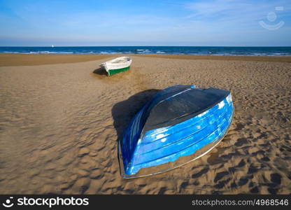 Valencia La Malvarrosa beach arenas beached boats in Spain