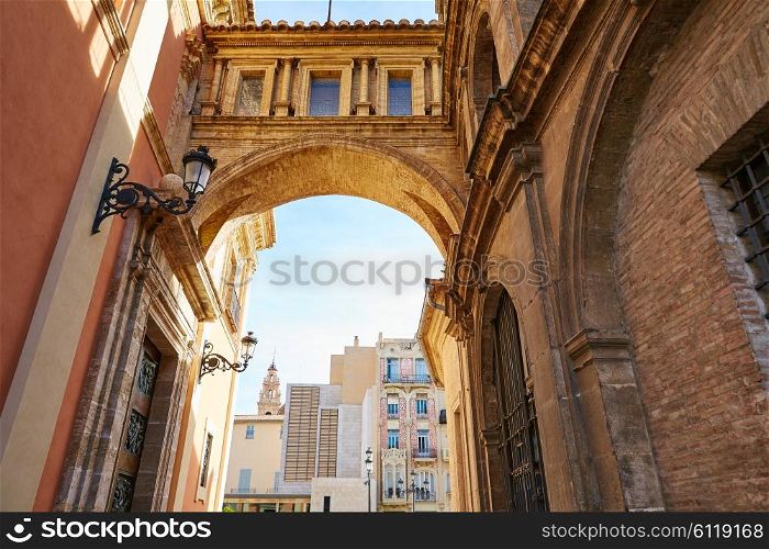 Valencia Plaza Virgen square with cathedral arch in Spain