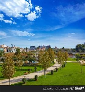 Valencia Turia river park gardens and skyline in Spain