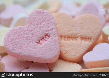 Valentine candy hearts in sweet colors, yes I love you text